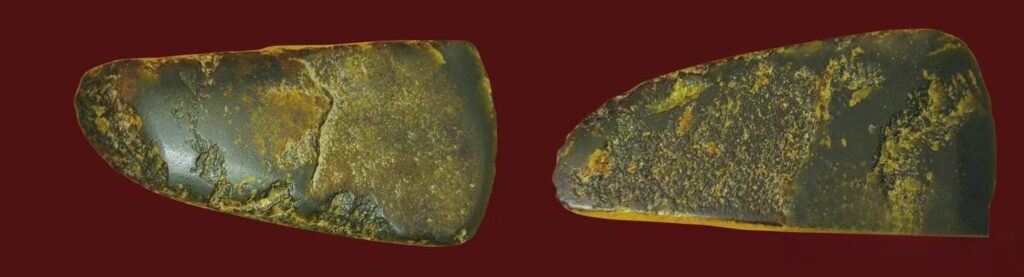 A pair of 12,000-year-old nephrite chopping tools unearthed from the Xiaogushan Cave site.