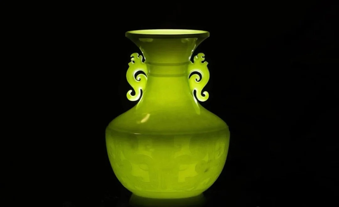 Thin-walled Ximu Jade vase featuring ancient Taotie and Kui dragon totems.