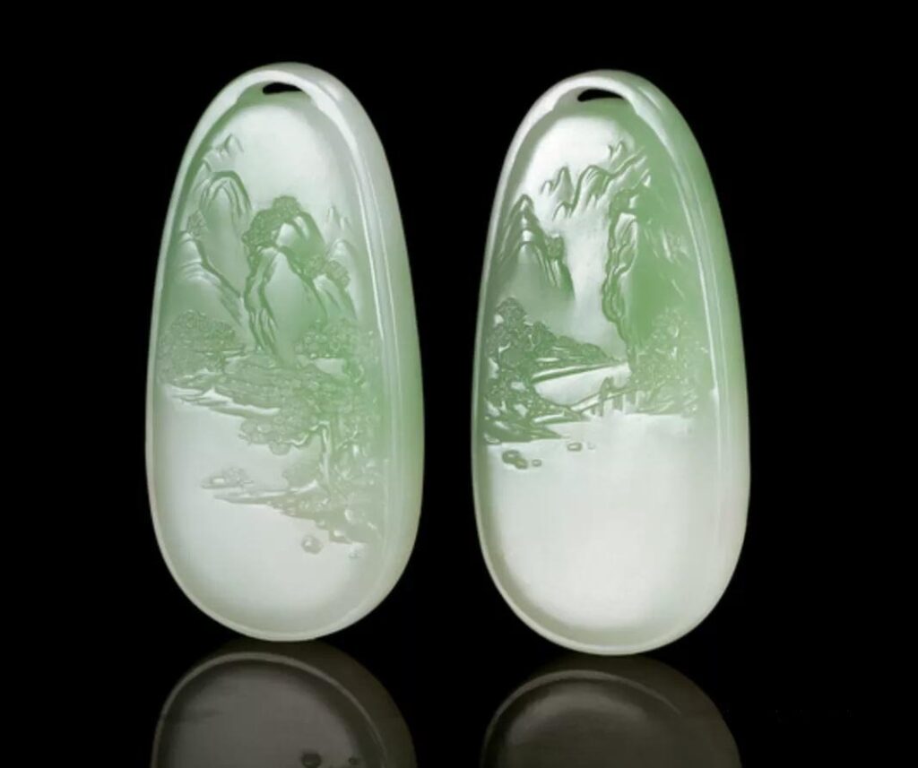 Paired Cui Qing Nephrite landscape pendants carved by Master Yao Shengguo.