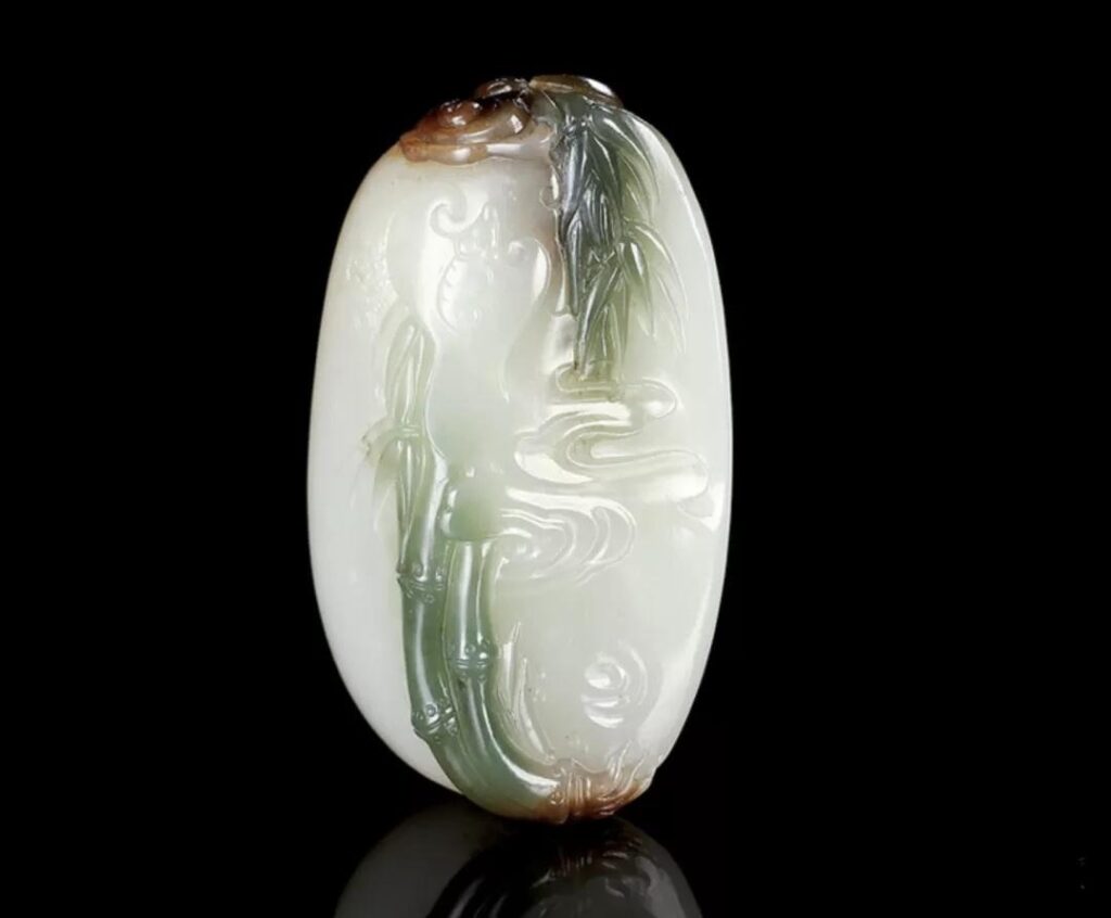 Hetian Seed Jade pendant with natural green "cui" accents, carved by Yu Lixiong.