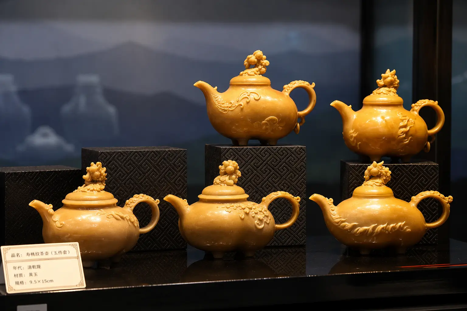Five yellow teapots crafted from Baoli Stone, one of the emerging stone carving materials.