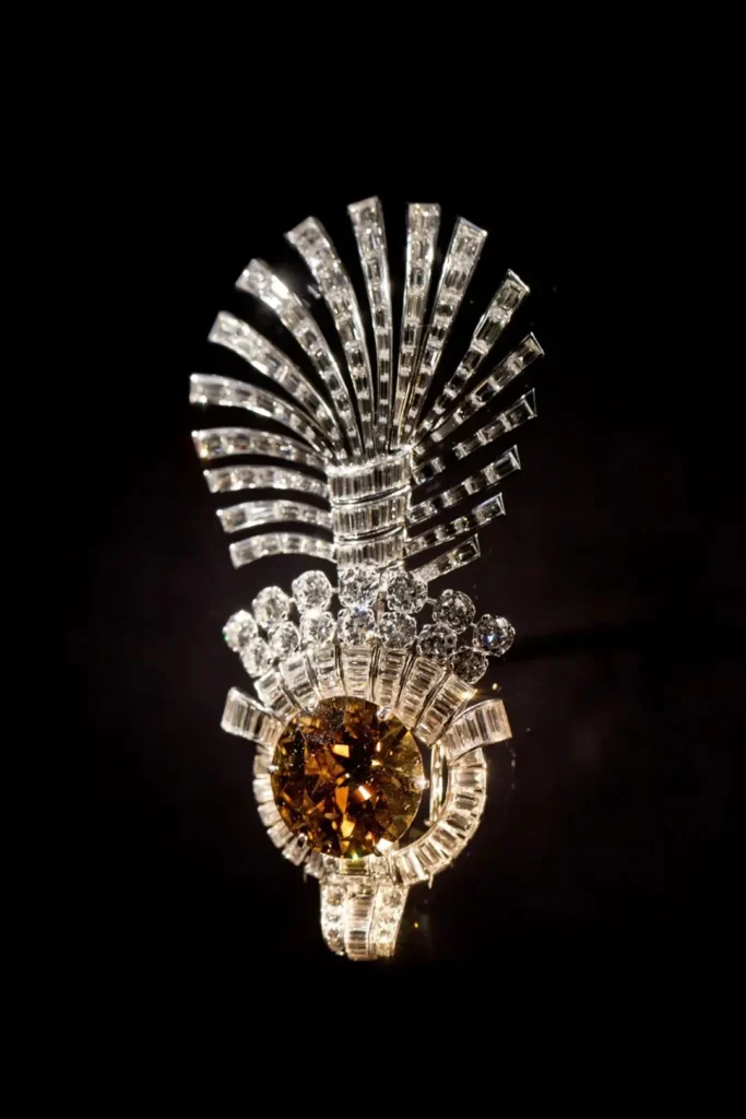 The 61.50 carat brown diamond in a Cartier aigrette headpiece with baguette diamond feathers.