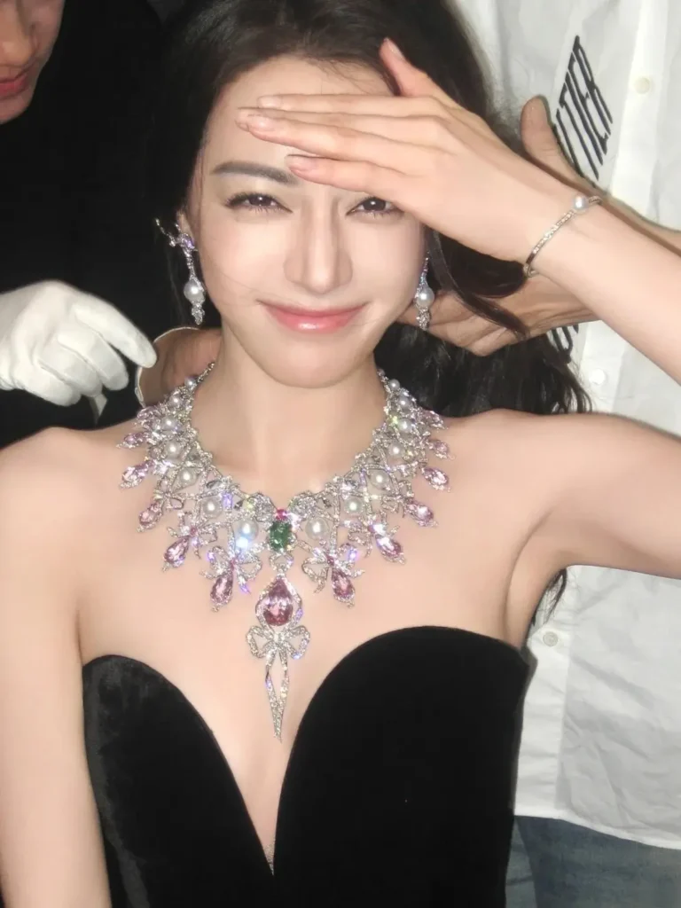 Dilraba Dilmurat wearing a high-jewelry necklace and earrings with visible flashes of diamond fire.