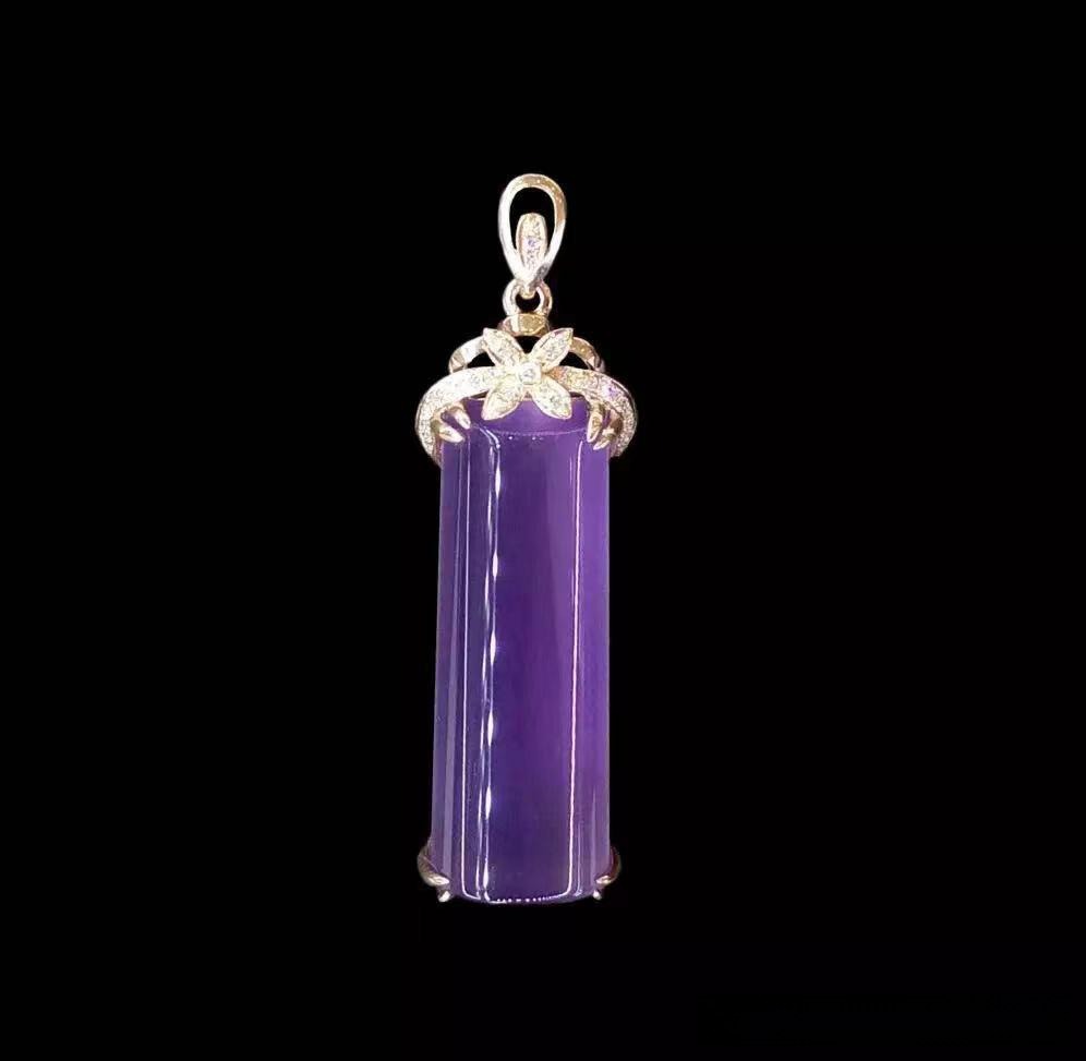 Vibrant purple Shanxi Datong chalcedony cylindrical pendant with a silver floral bail on a black background.
