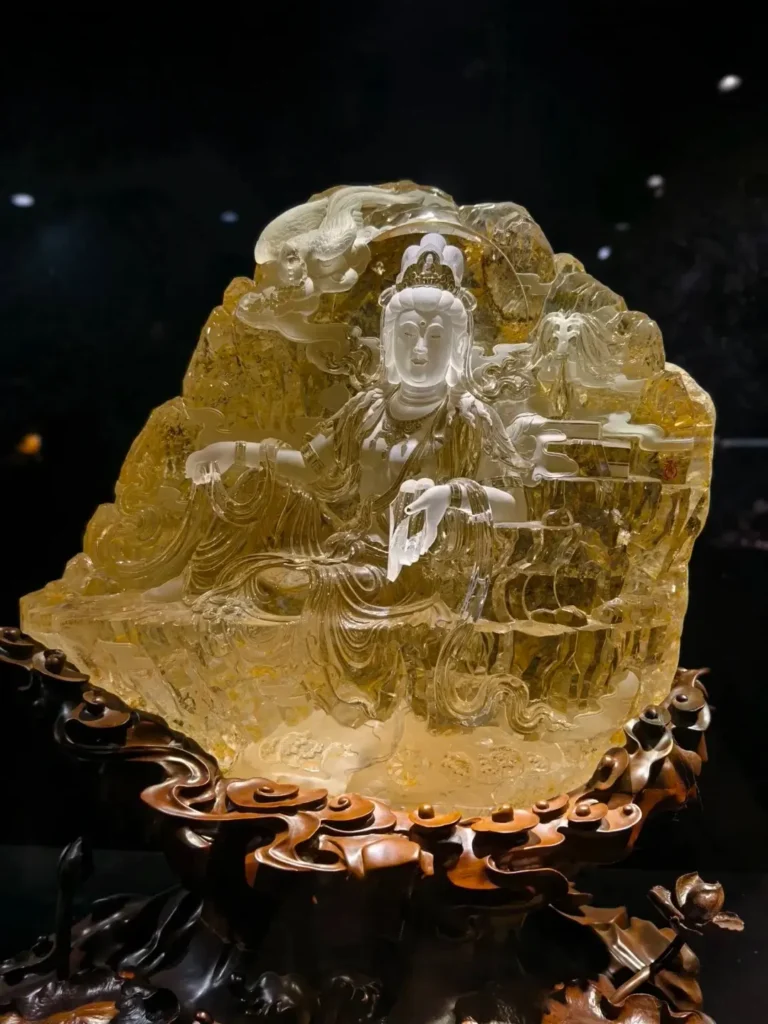Intricately carved Guanyin statue from Jiangsu, made of natural citrine quartz with frosted details.