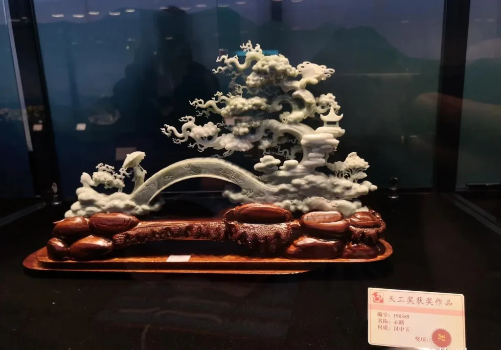 A scenic bridge and old tree carved from emerging jade carving materials, Hanzhong Jade.