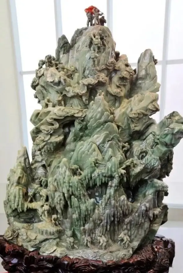 Massive Henan Mi Jade mountain sculpture Scaling the Heights with intricate lapidary carvings.