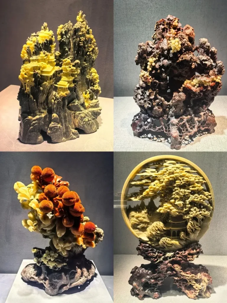 Four museum display cases showing highly detailed, multi-colored Qingtian stone sculptures.