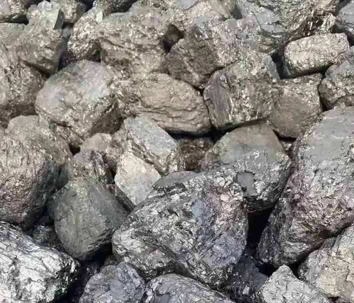 Coarse, dull-surfaced chunks of lignite coal with earthy textures and dark brownish-black tones.