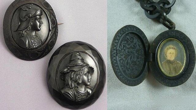 Antique Victorian jet stone jewelry featuring hand-carved cameos and an open locket with a portrait.