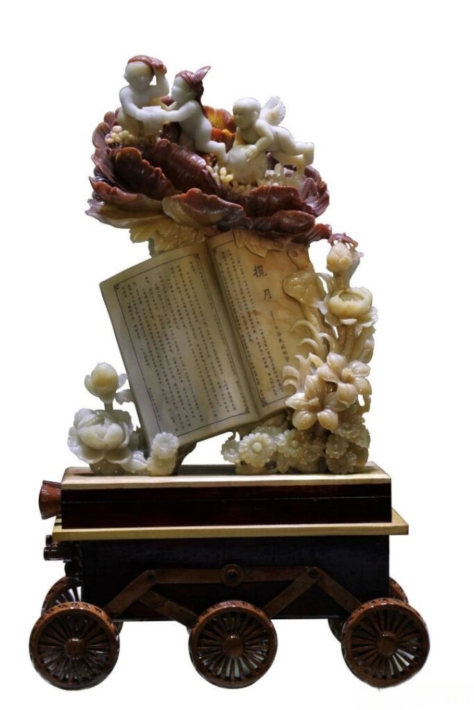 Zhao Guoan multicolor Henan Mi Jade sculpture featuring figures, flowers, and an open book.