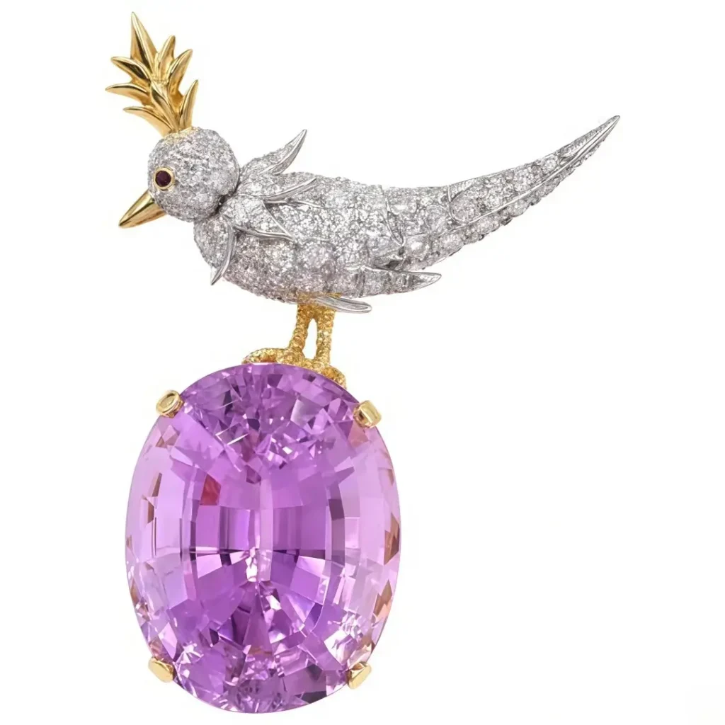 Tiffany Bird on a Rock brooch featuring a diamond bird perched on an oval pink stone.