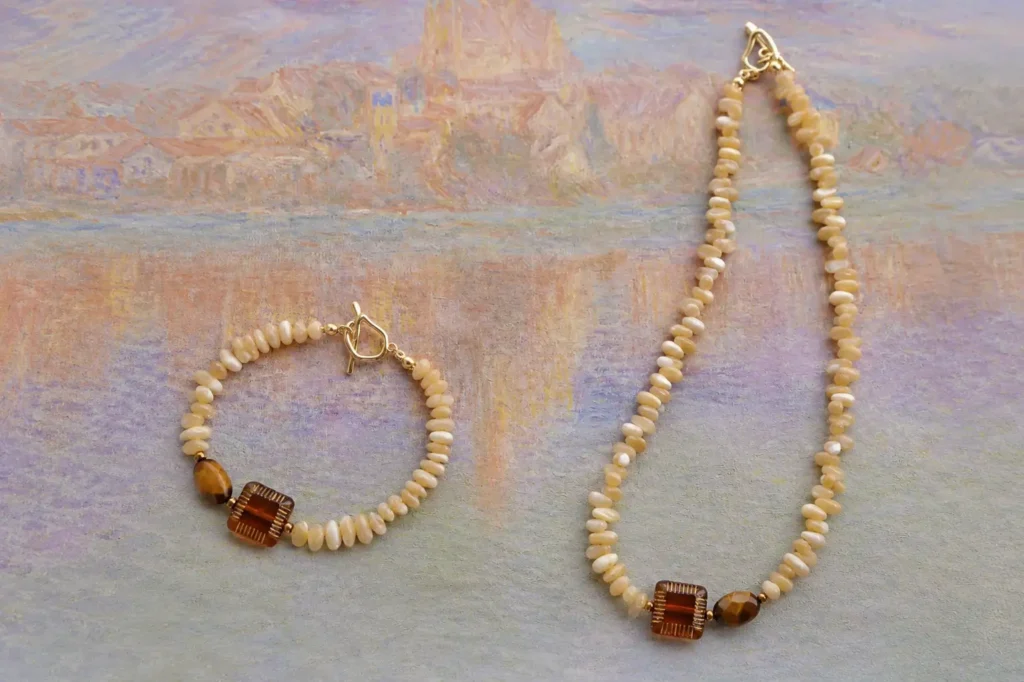 Handcrafted Trochus Shell necklace and bracelets with polished beads and natural pearly luster.