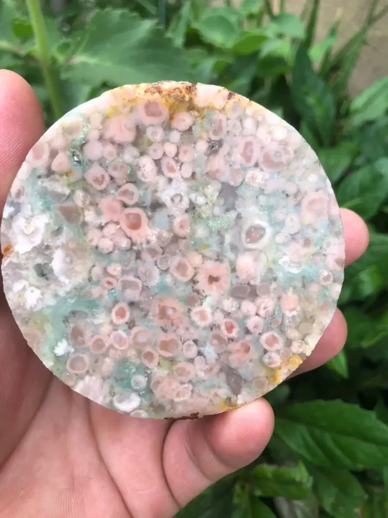 Round cherry blossom agate slice with pink and white natural mineral inclusions.
