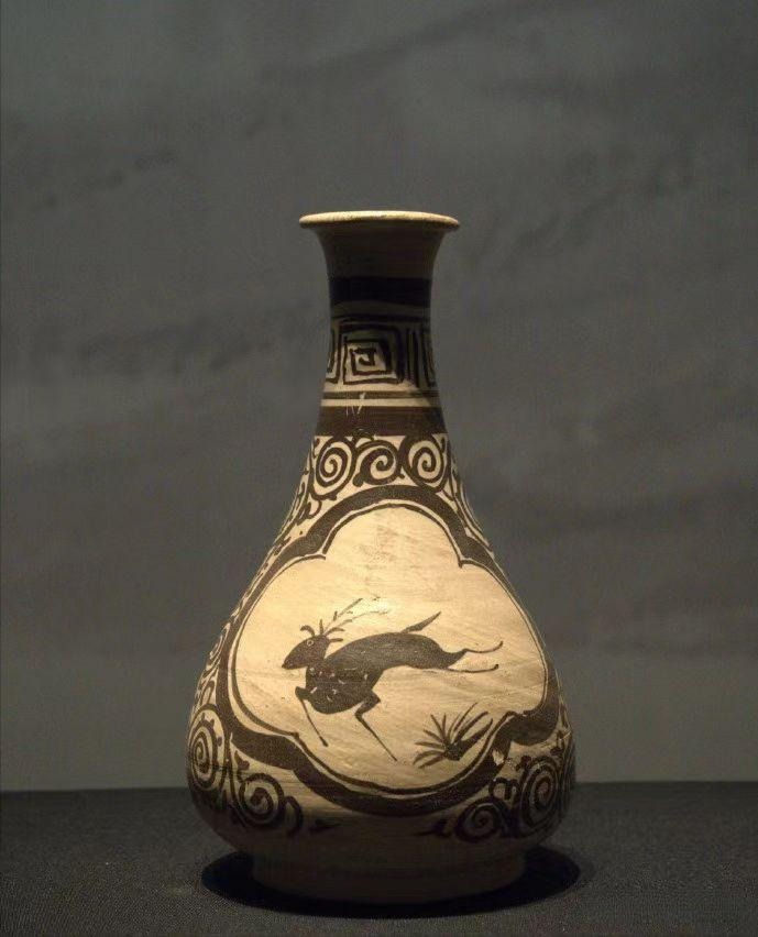 A Southern Song painted vase featuring a framed panel with a running deer and scroll motifs.