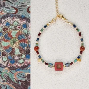 Vintage Czech glass beaded bracelet displayed beside Dunhuang mural art showing the color inspiration behind the design.