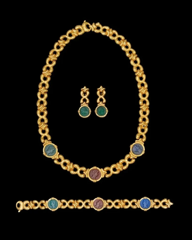 Italian glass cameo jewelry set with necklace, earrings, and bracelet in gold settings.