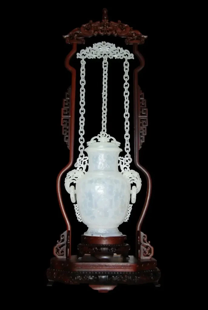 White jade vase featuring a multi-chain structure with several interconnected carved jade chains.
