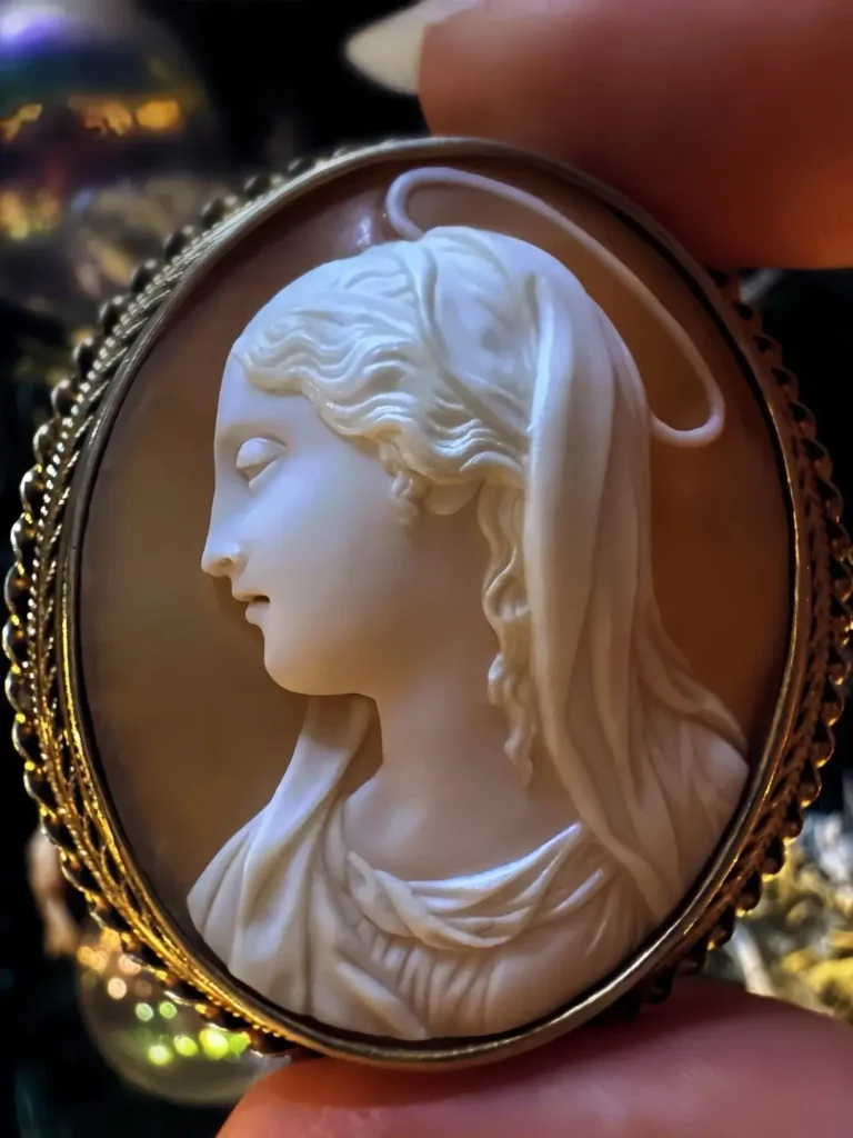 An 1880 French cameo featuring a high-relief Virgin Mary portrait.
