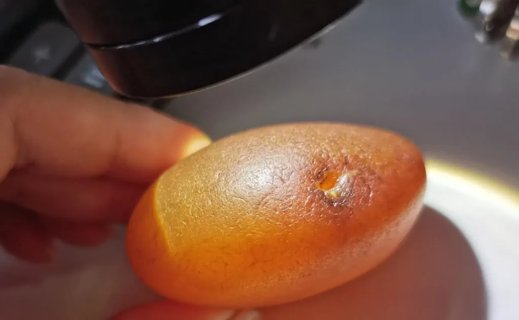 Water-worn agate rough from Madagascar with subtle nail-shaped marks