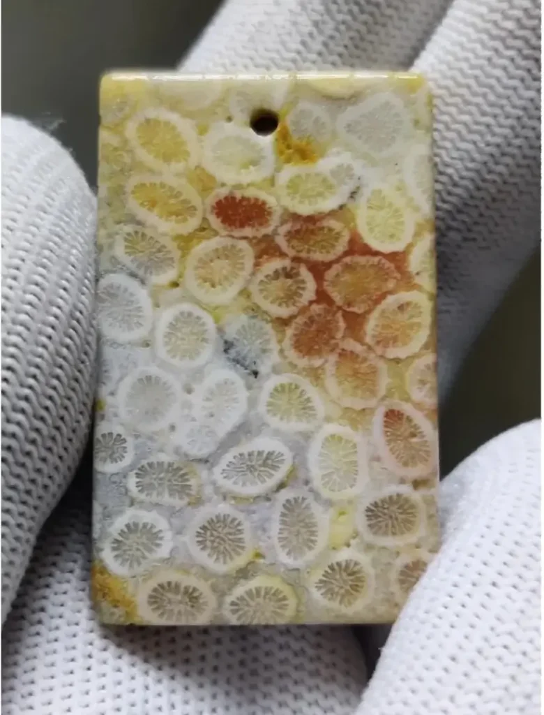 Square Coral Jade pendant with a pattern resembling a sliced lemon