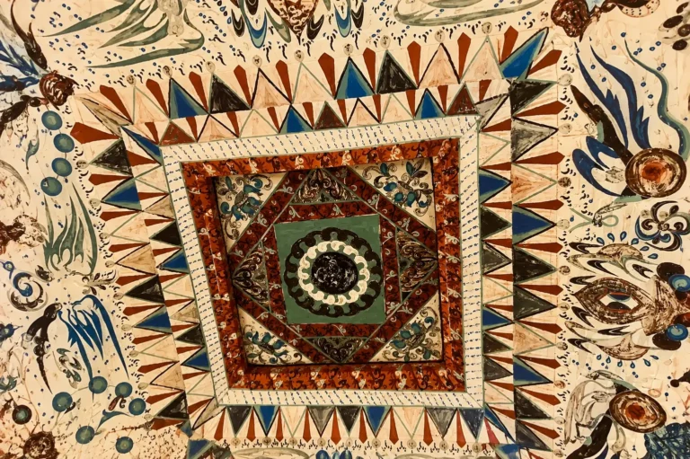 Dunhuang Cave 285 caisson ceiling mural with geometric patterns and vivid colors.