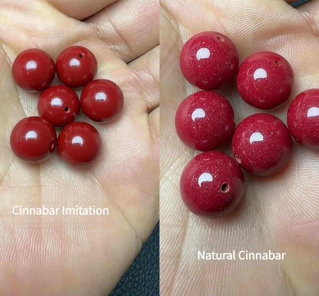 Hands holding imitation cinnabar beads on the left and natural cinnabar beads on the right.