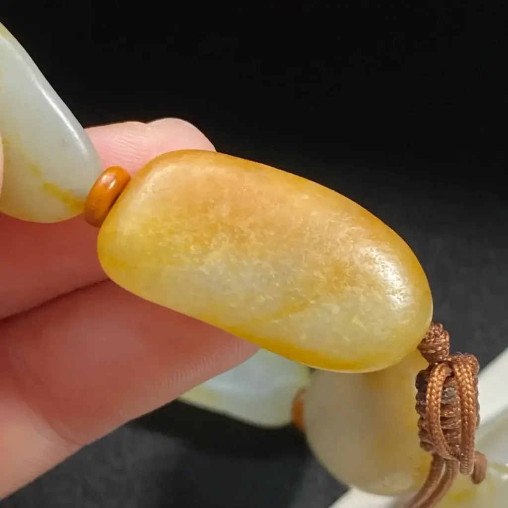 Close-up of a bead with vivid natural skin color extending beneath the surface.