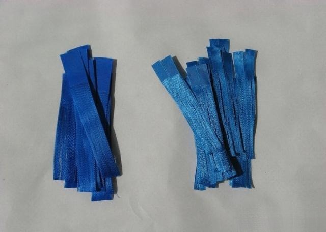 Neatly arranged blue ribbon strands air-dried after starch treatment, ready for faux Diancui jewelry making.
