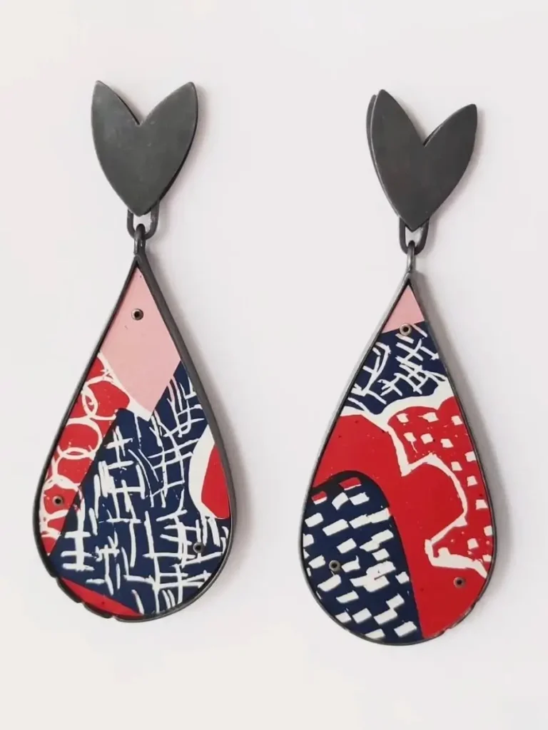 Lindsey Mann's panel earrings feature flat designs combining different colors.
